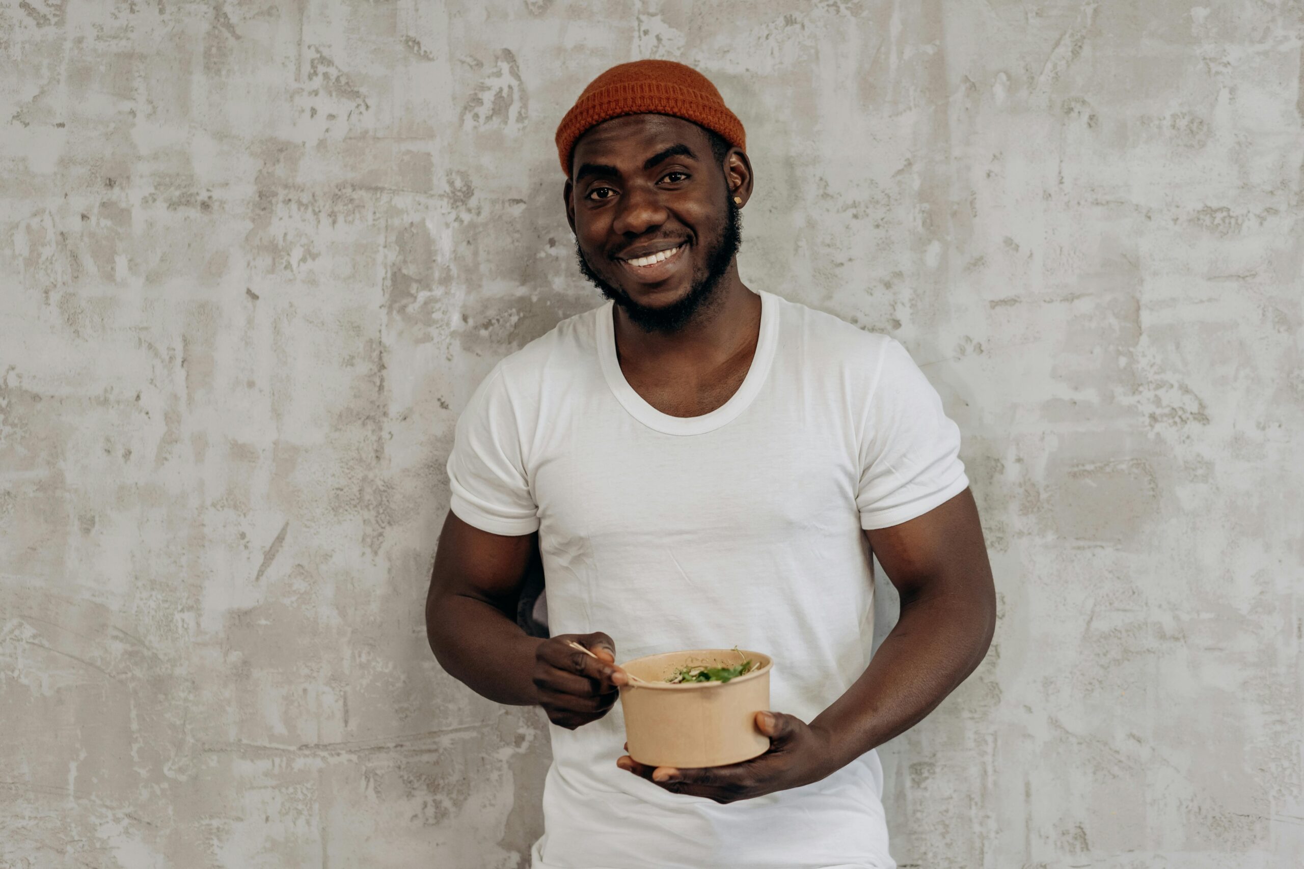 A vegetable enthusiast man holding bok choy dish
